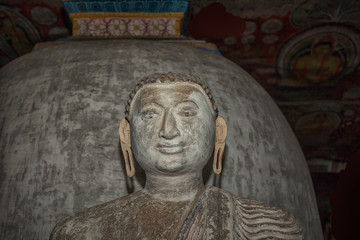 Fototapeta na wymiar Old stone Buddha statue