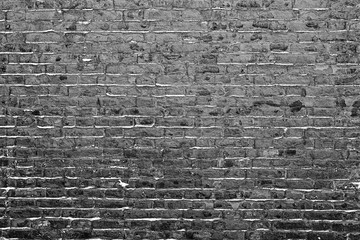 Texture of a brick wall with cracks and scratches