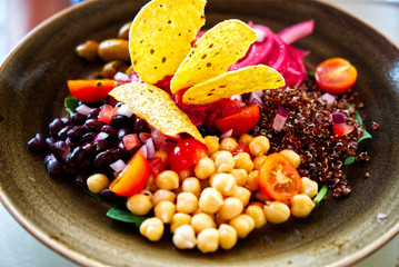 Healthy lunch salad including nachos style served on the platter including fresh bowls