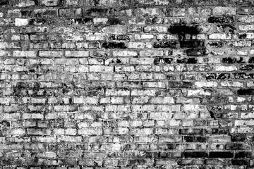 Texture of a brick wall with cracks and scratches