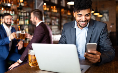 Fototapeta premium African american business man working with laptop in a restaurant