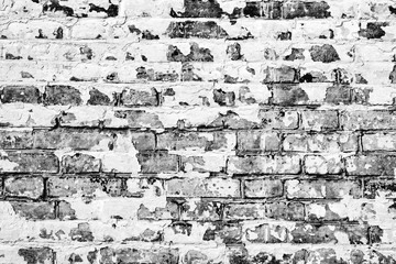 Texture of a brick wall with cracks and scratches
