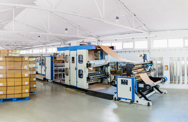Machine for paper bags in a factory