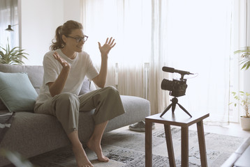 Youtuber recording a video in the living room