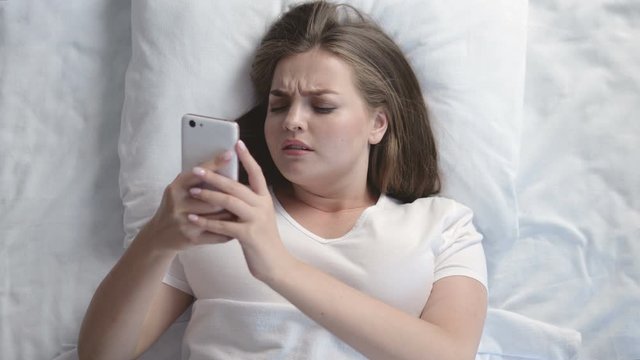 Frustrated overweight woman replying on messages with name-calling and mockery