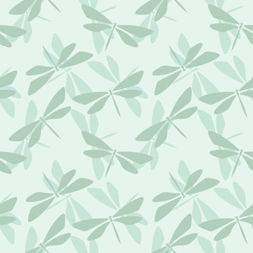 Seamless repeat pattern with dragonfly silhouettes. Random dragonflies vector background. Nature theme green background design perfect for fabric or wrapping paper.