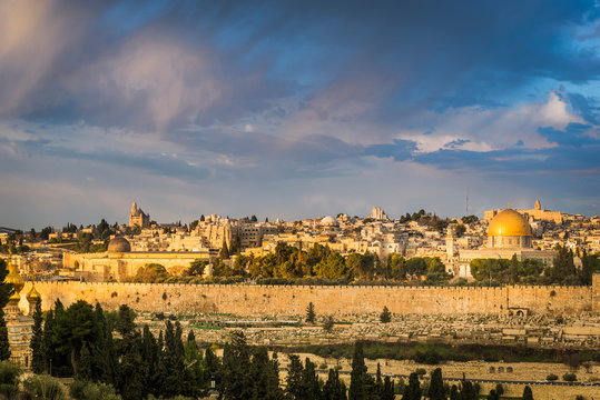 Beautiful morning light over the Old City of Jerusalem: Mount Zion, Jewish Quarter buildings, Hurva synagogue, the Temple Mount with Al Aqsa Mosque and Dome of the Rock; view from Mount of Olives