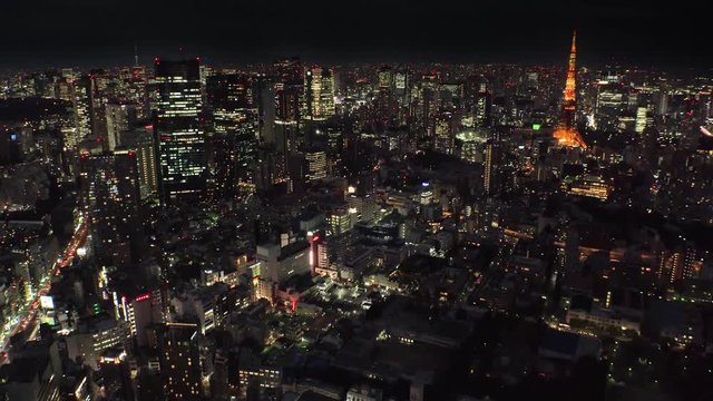 TOKYO, JAPAN : Aerial high angle sunrise CITYSCAPE of TOKYO. View of central downtown area around Roppongi. Japanese urban metropolis concept shot. Long time lapse shot night to morning.