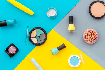 Beauty cosmetics and makeup products on colorful background. Flat lay, top view