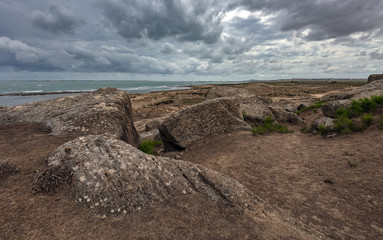 Rocky seasline in cloudy rainy weather