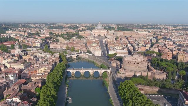 Aerial view of Rome, Castel Sant'Angelo (Castle of the Holy Angel) in foreground and Vatican City in background, bridges over river Tiber - cityscape of capital city of Italy from above, Europe