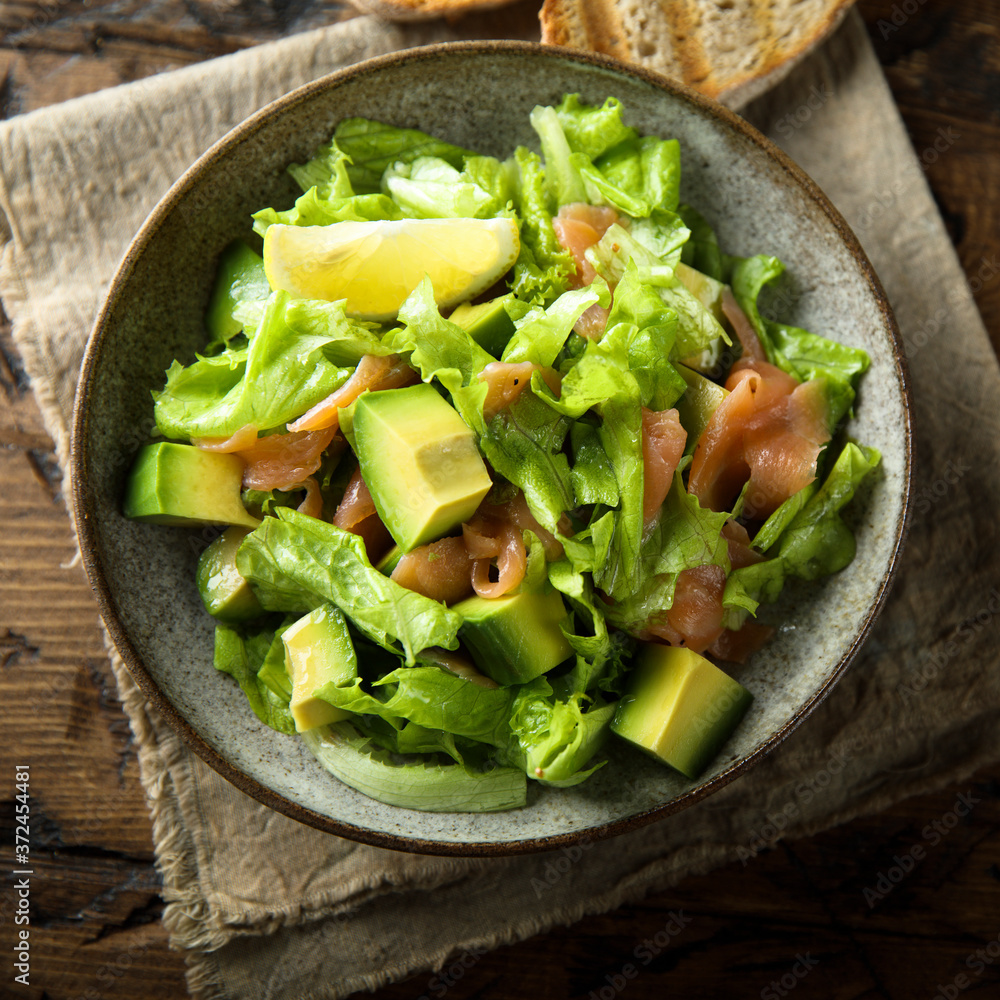 Poster healthy avocado salad with smoked salmon