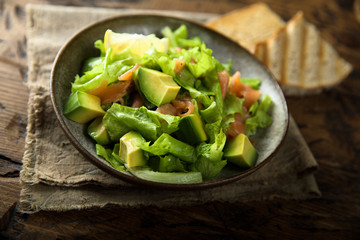 Healthy avocado salad with smoked salmon