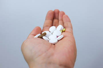 Male palm with tablets on a white background