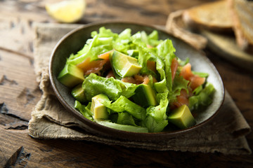 Healthy avocado salad with smoked salmon