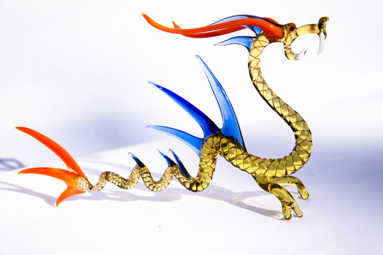 Murano Mouth Blown Dragon. Clear Golden Body, Orange And Blue Bone Plates And Eyes, White Teeth.