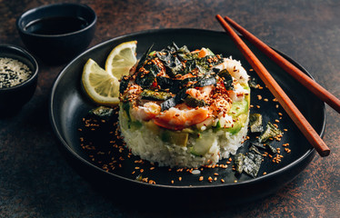 Spicy shrimp sushi stacks with layers of sushi rice, cucumbers and avocado spicy shrimp and furikake