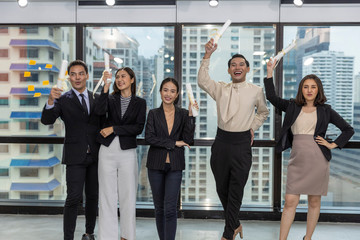 Naklejka premium Business office workers celebrate a great acheivement together after major effort. Award of great success by working together in a business office. Moment of appreciation with team sprite