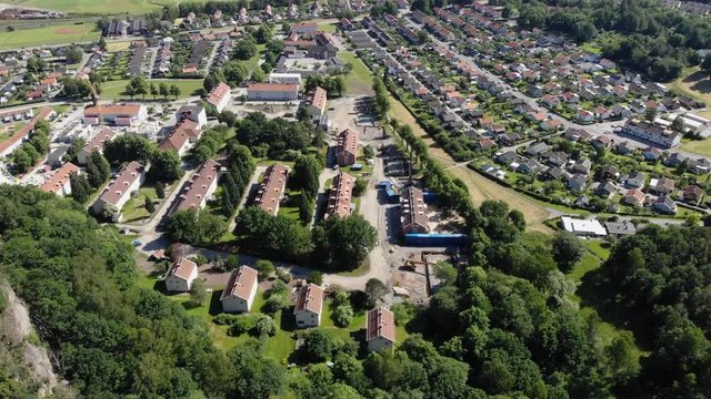 Aerial forward view by mountain in Utby Gotheburg district, sunny day