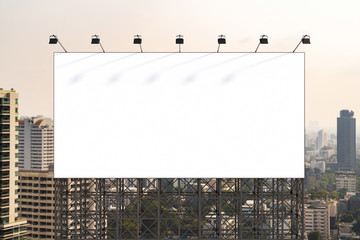 Obraz premium Blank white road billboard with Bangkok cityscape background at day time. Street advertising poster, mock up, 3D rendering. Front view. The concept of marketing communication to promote or sell idea.