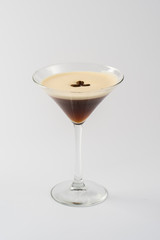 Alcoholic coffee cocktail in glass glass on white background
