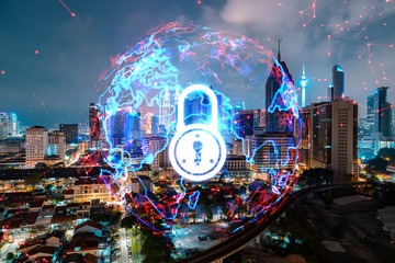Glowing Padlock hologram, night panoramic city view of Kuala Lumpur, Malaysia, Asia. The concept of cyber security to protect KL companies. Double exposure.