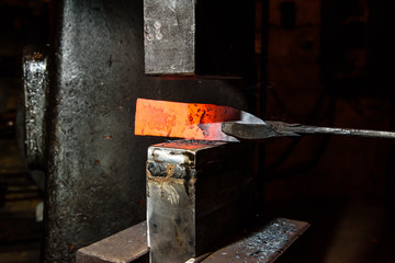 Forging molten metal. Making knives.