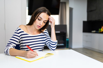 Nutritionist working in office. Doctor writing diet plan on table and using vegetables. Sport trainer. Lifestyle.
