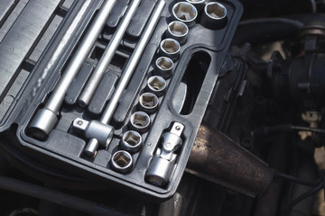 Mechanical toolbox with different wrenches for old car repair on maintenance.
