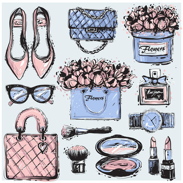 Big vector fashion sketch set in soft pink and blue colors. Hand drawn graphic shoes, bag, makeup brush, lipstick, powder, wrist watch, perfume, flower box, eye glasses, flowers.
