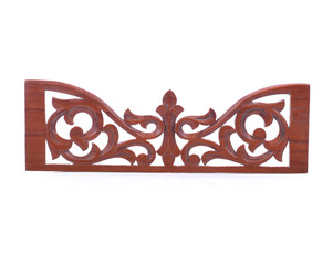 The wooden chair has a beautiful backrest in the finished home.