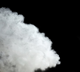 cloud of white wheat flour on a black background, particles fly in different directions, explosion and splash