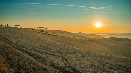 Fototapeta premium Beautiful sunrise over the Tuscany hills and fields. Travel destination Tuscany