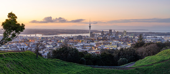 Auckland city skyline with Auckland Sky Tower from Mt. Eden at sunset New Zealand - obrazy, fototapety, plakaty
