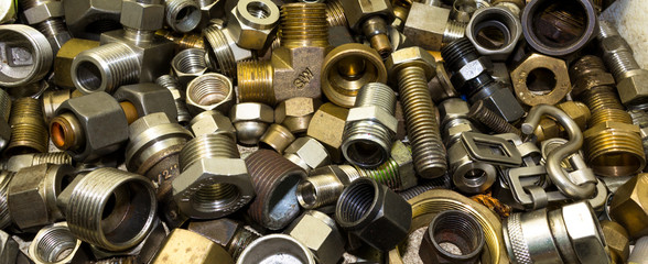 Close up of a silver, brass, steel and metal connections and fittings background
