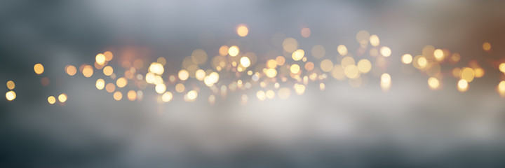 Golden bokeh background with fog
Abstract golden bokeh background with blur effects and sparks for a glamorous holiday concept.