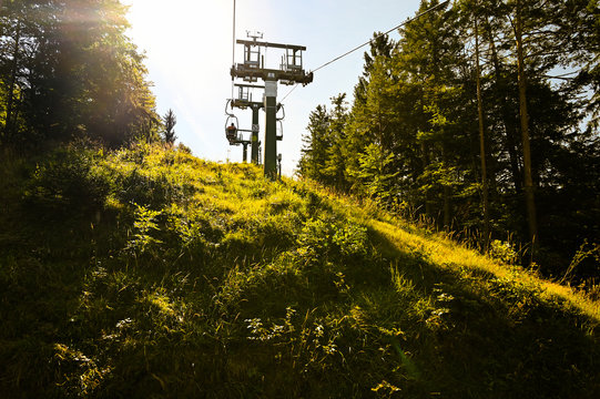 The Kaiserlift, a chairlift of the city of Kufstein, in the golden evening sun. It brings hikers to the beautiful Kaiser mountains near Kufstein, Austria.
