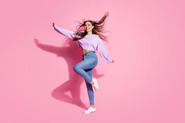 Full size profile side photo of candid satisfied girl enjoy rejoice free time raise hand wear good look mood clothes haircut air wind isolated pink color background