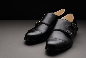 Male classic shoes. Elegant black monk shoes
