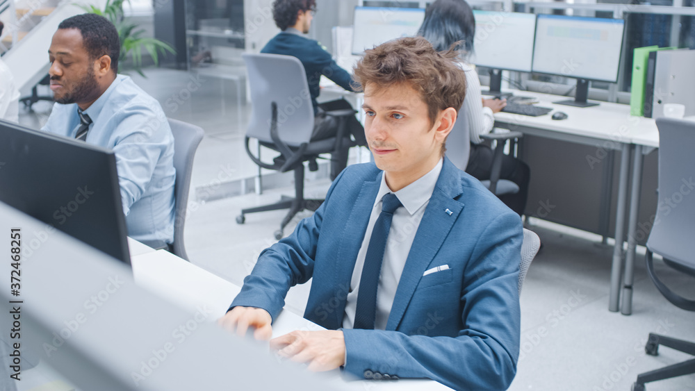 Poster Shot of Young Beautiful Business Manager Works on Desktop Computer. Divers Team of Motivated Successful Business Specialists Work in Modern Open Office.