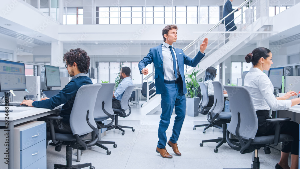 Poster young cheerful handsome business manager wearing a suit and tie dancing in the office. dances like r