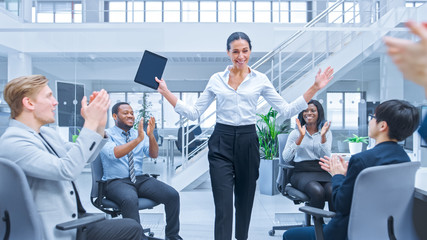 Beautiful Happy Business Woman Manager is Being Cheered and Celebrated by Her Colleagues due to Success. Diverse and Motivated Business People Work on Computers in Modern Open Office.