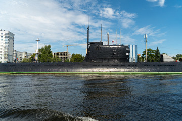 Fototapeta premium black submarine is parked in the port, central part of the boat