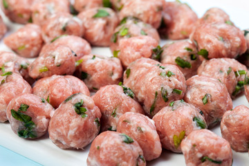 Top view of raw meat balls isolated on white. Meatballs and meatballs