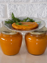 Zucchini caviar in jars on the table