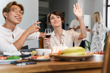 Group of happy cheerful friends having party