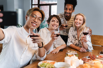 Group of people taking selfie