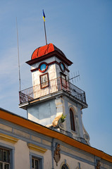 Leaning tower of historical town hall in Kuty, Ivano-Frankivsk region, Ukraine at sunny summer morning - obrazy, fototapety, plakaty