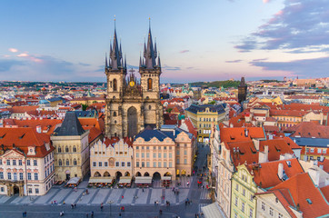 Obraz premium Top aerial view of Prague Old Town Square (Stare Mesto) historical city centre. Former market square. Stone Bell House, Gothic Church of Our Lady before Tyn, evening view. Bohemia, Czech Republic