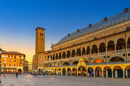 Palazzo della Ragione medieval town hall and palace of justice building, Torre degli Anziani tower in Piazza dei Frutti square in Padua historical centre, twilight evening view, Veneto Region, Italy